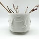 thumbnail image 1 of Florero caras bajo ancho, 1 of 3
