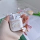 thumbnail image 2 of Estuche transparente con llavero para Airpods 2/1 de Minneapolis, diseño de orejas grandes, lazo de perro blanco, corazón y arcoíris, de silicona suave, resistente a los golpes, compatible con el estu, 2 of 7