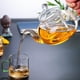 thumbnail image 5 of Tetera de vidrio transparente de 600 ml (20,3 oz) apta para estufa, con infusor extraíble, hojas sueltas y té floreciente., 5 of 6