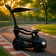 thumbnail image 2 of Auto Correpasillo Con Mango Sombrilla, Luces y Sonido Negro, 2 of 5