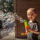 thumbnail image 4 of Bubble Gun Haktoys Jurassic Dinosaur con 2 botellas de recarga, 4 of 7