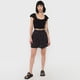 thumbnail image 4 of Falda Mujer Cintura Botones Negro Mini Print Corona, 4 of 5