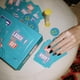 thumbnail image 5 of Party Game DSS Games You Laugh You're Out con 125 tarjetas rápidas, 5 of 7