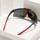 thumbnail image 3 of POLASUP GAFAS LENTES DE SOL Gafas de sol deportivas con lentes iridiscentes naranja y verde, montura negra y detalles rojos. Diseño aerodinámico, protección UV 400. Ideales para ciclismo, 3 of 8
