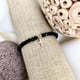 thumbnail image 2 of Pulsera con cristales negros y cruz bañada en oro 24k, 2 of 3