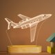 thumbnail image 1 of Lámpara nocturna con forma de avión, ilusión 3D, mesa de madera, alimentación USB, 1 of 7