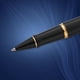 thumbnail image 4 of Bolígrafo Rollerball Expert Gloss Negro Con Detalles En Oro De 23 Quilates, 4 of 7