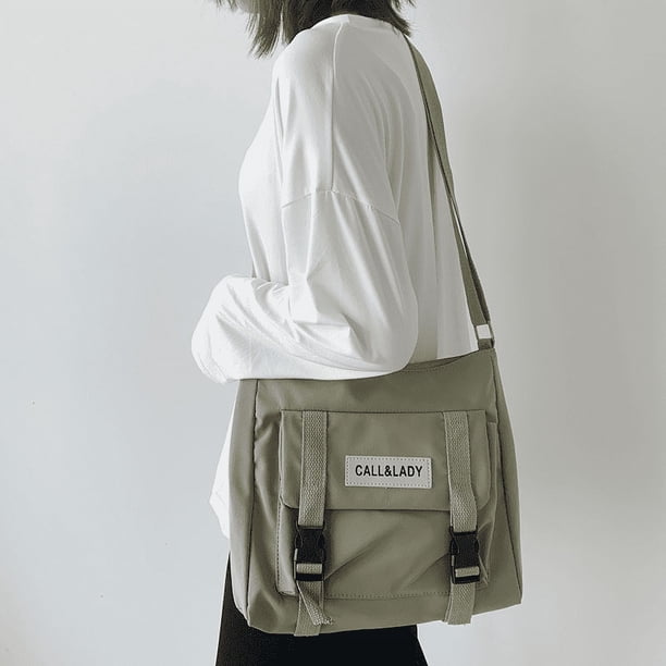Upgrade Your Preppy Style with Our Trendy Shoulderbag - Perfect for Students! Featuring a Cute Cartoon Decor and Spacious Interior with Plastic Buckle and Zipper Closure.
