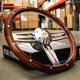 thumbnail image 1 of Volante Newworldmotoring 36 cm Madera Pulida con Botón de Claxon Bowtie, 1 of 7
