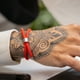 thumbnail image 5 of Pulsera roja unisex con dije ajustable, 5 of 7