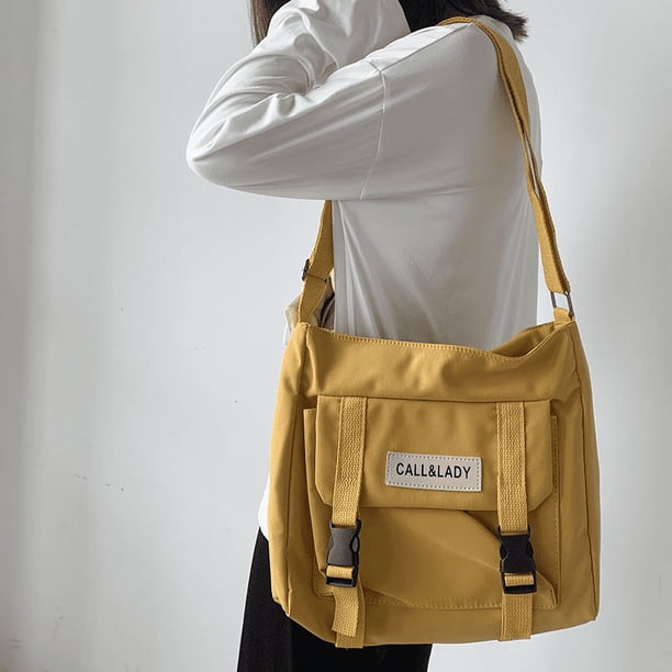 Upgrade Your Preppy Style with Our Trendy Shoulderbag - Perfect for Students! Featuring a Cute Cartoon Decor and Spacious Interior with Plastic Buckle and Zipper Closure.