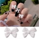 thumbnail image 2 of Paquete de 50 lazos de manicura blancos clásicos, cinta estéreo de resina simple para joyería de uñas, 2 of 5