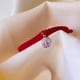 thumbnail image 2 of Pulsera Roja de Protección San Benito para Bebés y niños, Ajustable y Hecha a Mano, 2 of 4