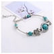 thumbnail image 2 of Pulsera Turquesa y Abalorios Mariposa, 2 of 2