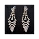 thumbnail image 1 of Aros Colgantes Con Pedreria Y Brillo Color Dorado, 1 of 2
