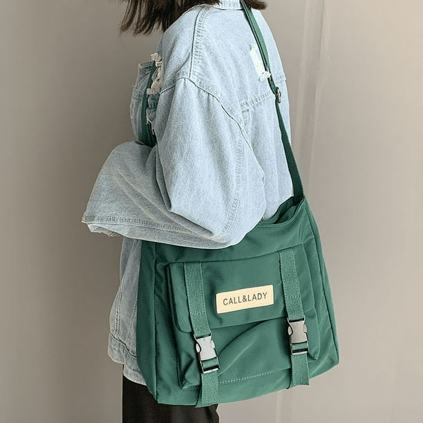 Upgrade Your Preppy Style with Our Trendy Shoulderbag - Perfect for Students! Featuring a Cute Cartoon Decor and Spacious Interior with Plastic Buckle and Zipper Closure.