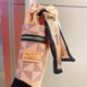 thumbnail image 3 of Stylish Mini Coin Purse with Classic Pattern and Faux Leather Material - Perfect for Storing Lipstick, Headphones, and More, 3 of 4