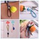 thumbnail image 5 of Llavero de cuero trenzado con funda de anillo de acero inoxidable, cordón de muñeca tejido de PU, púrpura, 5 of 5