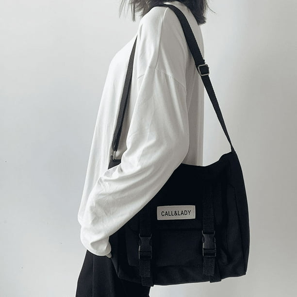 Upgrade Your Preppy Style with Our Trendy Shoulderbag - Perfect for Students! Featuring a Cute Cartoon Decor and Spacious Interior with Plastic Buckle and Zipper Closure.