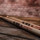 thumbnail image 5 of Baquetas Vic Firth American Classic 2B, paquete de 3 con tela, 5 of 5
