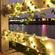thumbnail image 2 of Guirnalda de luces LED tipo cortina, luces de ratán decorativas para patio al aire libre con forma de enredadera en cascada, 2 of 5