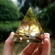 thumbnail image 1 of Pirámide de orgonita, decoración del hogar, hecha a mano, pirámide de orgonita con árbol de la vida, peridoto de 60 mm con piedra de cristal de ojo de tigre, acumulador de orgonita, energía EMF de org, 1 of 7
