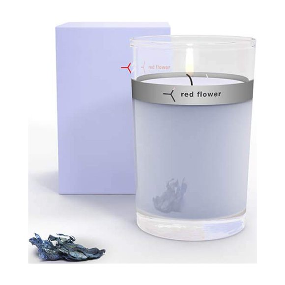 Vela con forma de flor de luna islandesa con flor roja en la parte superior