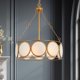 thumbnail image 1 of Candelabro KSANA de 3 luces con tambor dorado de 42 cm, 1 of 9