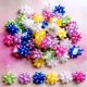 thumbnail image 3 of Lazos para regalos elify 6 cm 60 piezas arcoíris en forma de estrella, 3 of 4