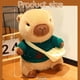 thumbnail image 2 of Peluche TITQWOP Capibara con 9 prendas y accesorios de 26 cm, 2 of 6