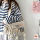 thumbnail image 2 of Get Ready for Campus with our Large Capacity Canvas Crossbody Bag - Fashionable and Spacious Shoulder Purse with Bag Charm, 2 of 4