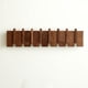thumbnail image 1 of Perchero de pared QUELLANCE Wood con 8 ganchos en madera de nogal, 1 of 7