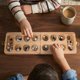 thumbnail image 5 of Juego de Mesa Mancala Ajuny Plegable para Viajar, 5 of 8