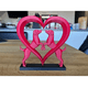 thumbnail image 1 of Elegante escultura de corazón de perro, 1 of 2
