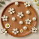 thumbnail image 3 of Charms para zapatillas Daisy con perlas, 18 piezas, 3 of 3