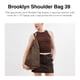 thumbnail image 2 of Bandolera COACH Brooklyn 39 de piel granulada natural, 2 of 6