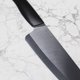 thumbnail image 4 of Juego de cuchillos de cerámica KYOCERA 3 piezas Santoku, utilitario y de pelar – negro, 4 of 6