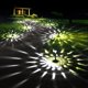 thumbnail image 1 of Luces solares para senderos GIGALUMI, paquete de 12, impermeables, blanco frío, 1 of 8