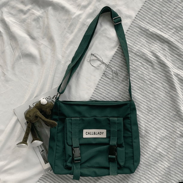 Upgrade Your Preppy Style with Our Trendy Shoulderbag - Perfect for Students! Featuring a Cute Cartoon Decor and Spacious Interior with Plastic Buckle and Zipper Closure.