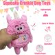 thumbnail image 2 of Juguete para perro HUGEME Monstruo de peluche rosa con chirrido de cumpleaños, 2 of 8