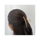 thumbnail image 2 of Traba Metálica Brillante Garra Tiburón De Cabello Dorado, 2 of 2