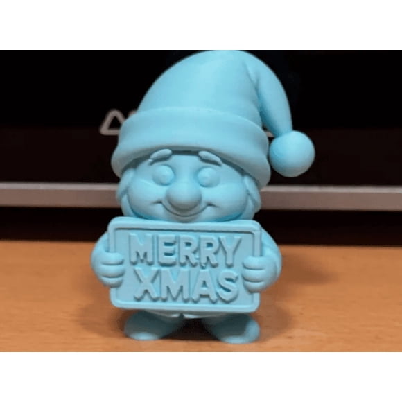 Gnomo con cartel de Feliz Navidad