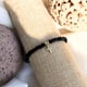 thumbnail image 1 of Pulsera con cristales negros y cruz bañada en oro 24k, 1 of 3