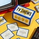 thumbnail image 2 of Juego de mesa Brass Monkey Poorly Explained TV Shows, 2 of 2