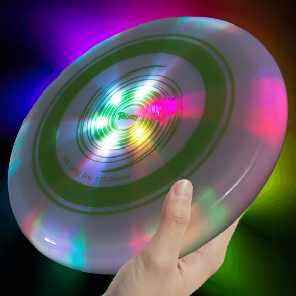 La luz LED Flying Disc Toysery ilumina un frisbee que brilla en la oscuridad