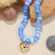 thumbnail image 5 of Collar Wassazi Azul con Cuentas Gruesas y Dije de Corazón Abultado, 5 of 7