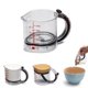 thumbnail image 1 of Taza Medidora Ajustable Todo en Uno Dreamfarm Upcup, Medidas Métricas e Imperiales hasta 1 Taza - Negro/Transparente, 1 of 9