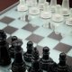 thumbnail image 4 of Juego de ajedrez vanguardista de vidrio esmerilado negro con tablero de espejo, 4 of 8