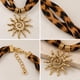 thumbnail image 2 of Collar Mujer Pañuelo Animal Print Leopardo Con Dije Sol dorado 22, 2 of 3