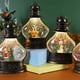 thumbnail image 2 of Bolas de nieve navideñas con forma de farol, bola de nieve cilíndrica con purpurina, bolas de nieve navideñas de bronce, linterna con decoración de muñeco de nieve y árbol de Navidad., 2 of 5